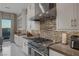 Gourmet kitchen featuring stainless steel appliances, designer backsplash, and mountain views at 2171 King Crest Ct, Henderson, NV 89052