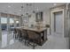 Modern kitchen featuring an island with seating, stainless steel appliances, and a breakfast nook at 2171 King Crest Ct, Henderson, NV 89052