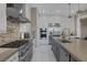 Well-appointed kitchen with stainless appliances, large island, and modern finishes at 2171 King Crest Ct, Henderson, NV 89052