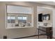 Open-plan living area featuring floor-to-ceiling windows with stunning views and a cozy atmosphere at 2171 King Crest Ct, Henderson, NV 89052
