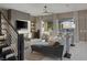 Inviting living room with stylish decor, a cozy fireplace, and an abundance of natural light at 2171 King Crest Ct, Henderson, NV 89052