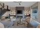 Modern living room featuring a stylish fireplace, built-in shelving, and neutral color palette at 2171 King Crest Ct, Henderson, NV 89052