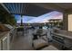 Stunning outdoor living space with a large pool, spa, outdoor kitchen, and comfortable seating at 2171 King Crest Ct, Henderson, NV 89052
