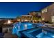 Stunning pool with spa, fire features, and covered patio is perfect for outdoor entertaining with scenic views at 2171 King Crest Ct, Henderson, NV 89052