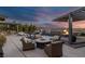 Luxury pool and outdoor space with a fire pit, sun loungers, lounge chairs and city views at 2171 King Crest Ct, Henderson, NV 89052