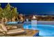 Inviting backyard pool and spa with a fire feature and city views in a luxury setting at 2171 King Crest Ct, Henderson, NV 89052