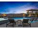 Resort-style pool with lounge chairs, fire bowls, and mountain views at 2171 King Crest Ct, Henderson, NV 89052