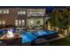 Backyard features a swimming pool, spa, and patio with firepit at 2171 King Crest Ct, Henderson, NV 89052