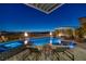Swimming pool and lounge chairs with mountain views at 2171 King Crest Ct, Henderson, NV 89052