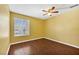 A bedroom features wood-look floors, a ceiling fan and a window with blinds at 2200 S Fort Apache Rd # 2175, Las Vegas, NV 89117