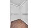 A walk-in closet features wood-look floors and white shelving at 2200 S Fort Apache Rd # 2175, Las Vegas, NV 89117
