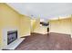 Open living area with a fireplace and view into the kitchen at 2200 S Fort Apache Rd # 2175, Las Vegas, NV 89117