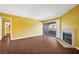 Bright living room with fireplace, sliding glass doors to patio, and tile surround at 2200 S Fort Apache Rd # 2175, Las Vegas, NV 89117