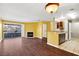 Open living area featuring fireplace, access to the kitchen, and balcony access at 2200 S Fort Apache Rd # 2175, Las Vegas, NV 89117