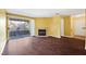 Spacious living room with wood floors, fireplace, and sliding glass doors to balcony at 2200 S Fort Apache Rd # 2175, Las Vegas, NV 89117