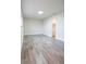 Well-lit bedroom featuring modern wood-look floors, recessed lighting, and ample closet space at 223 Greenbriar Townhouse Way, Las Vegas, NV 89121