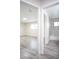 Hallway showing access to the updated bathroom and bedroom with modern design elements at 223 Greenbriar Townhouse Way, Las Vegas, NV 89121