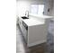 Modern kitchen featuring white cabinetry, sleek countertops, and stainless steel appliances at 223 Greenbriar Townhouse Way, Las Vegas, NV 89121