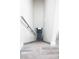 Downstairs view of gray stairs with white walls, a gray handrail, and landing at 223 Greenbriar Townhouse Way, Las Vegas, NV 89121