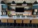 This bar features sleek countertops, pendant lighting, and modern appliances at 2379 Albury Ave, North Las Vegas, NV 89086