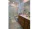 Well-lit bathroom with double sink vanity, framed mirrors, and walk-in shower at 2379 Albury Ave, North Las Vegas, NV 89086