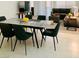 Modern dining room featuring marble table with seating and a large window at 2379 Albury Ave, North Las Vegas, NV 89086