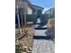 Charming front entrance with stone pavers and desert landscaping leading to a cozy home at 2379 Albury Ave, North Las Vegas, NV 89086