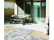 This patio features a picnic table and a decorative brick-and-gravel design at 2379 Albury Ave, North Las Vegas, NV 89086