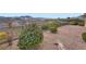 Backyard with gravel landscaping, a wrought-iron fence, and views of the scenic hills at 2388 Orangeburg Pl, Henderson, NV 89044