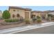 Charming home with manicured landscaping, a stone-accented facade, and a neatly paved driveway at 2388 Orangeburg Pl, Henderson, NV 89044