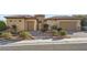 Charming home with manicured landscaping, a stone-accented facade, and a neatly paved driveway at 2388 Orangeburg Pl, Henderson, NV 89044