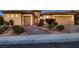Stunning front exterior features a well-manicured lawn, paved driveway, and attractive desert landscaping at 2388 Orangeburg Pl, Henderson, NV 89044