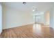 Bright living room features wood floors, shuttered windows, and a ceiling fan at 2388 Orangeburg Pl, Henderson, NV 89044