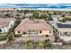 A single-story home featuring a tile roof, neutral stucco, and a low maintenance rock garden in the backyard at 2388 Orangeburg Pl, Henderson, NV 89044