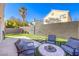 Backyard featuring artificial turf and a modern seating area, perfect for entertaining guests at 4125 Glenfield Cir, Las Vegas, NV 89129