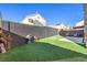 Serene backyard with artificial turf and privacy fence at 4125 Glenfield Cir, Las Vegas, NV 89129