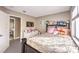 Comfortable bedroom featuring a bed, television, and closet in a neutral color palette at 4125 Glenfield Cir, Las Vegas, NV 89129