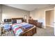 Bedroom with neutral carpet, natural light, and dark wood furniture for a tranquil space at 4125 Glenfield Cir, Las Vegas, NV 89129