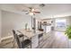 Inviting dining area flows into a modern kitchen with stainless steel appliances and a breakfast bar at 4125 Glenfield Cir, Las Vegas, NV 89129