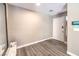 Entryway with hardwood floors, white door, and a modern electronic device at 4125 Glenfield Cir, Las Vegas, NV 89129