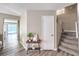 Hallway with modern flooring, a convenient coat closet, and stairs leading to the upper level at 4125 Glenfield Cir, Las Vegas, NV 89129