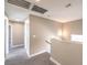 Spacious hallway with neutral carpet, light walls, and white trim provides access to multiple rooms at 4125 Glenfield Cir, Las Vegas, NV 89129