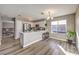 Well-lit kitchen offering a breakfast bar, stainless steel appliances, and access to living spaces at 4125 Glenfield Cir, Las Vegas, NV 89129