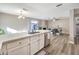 Open-concept kitchen with a breakfast bar overlooking the dining area and living room at 4125 Glenfield Cir, Las Vegas, NV 89129