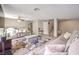 Open-concept living room features modern flooring, neutral tones, comfortable seating, and stylish accents at 4125 Glenfield Cir, Las Vegas, NV 89129
