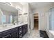 Bathroom features a double sink vanity, glass enclosed shower, and a walk-in closet at 4459 Lavender, Pahrump, NV 89061