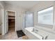 Bright bathroom with a large soaking tub and a glass-enclosed shower at 4459 Lavender, Pahrump, NV 89061