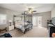 Light-filled bedroom offers a canopy bed, a walk-out balcony, and great natural light at 4459 Lavender, Pahrump, NV 89061