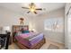 Bedroom with a ceiling fan, natural light, and closet featuring ample space and comfortable furnishings at 4459 Lavender, Pahrump, NV 89061