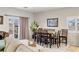 Dining area with sliding glass doors, decorative picture on the wall, and set dining table at 4459 Lavender, Pahrump, NV 89061